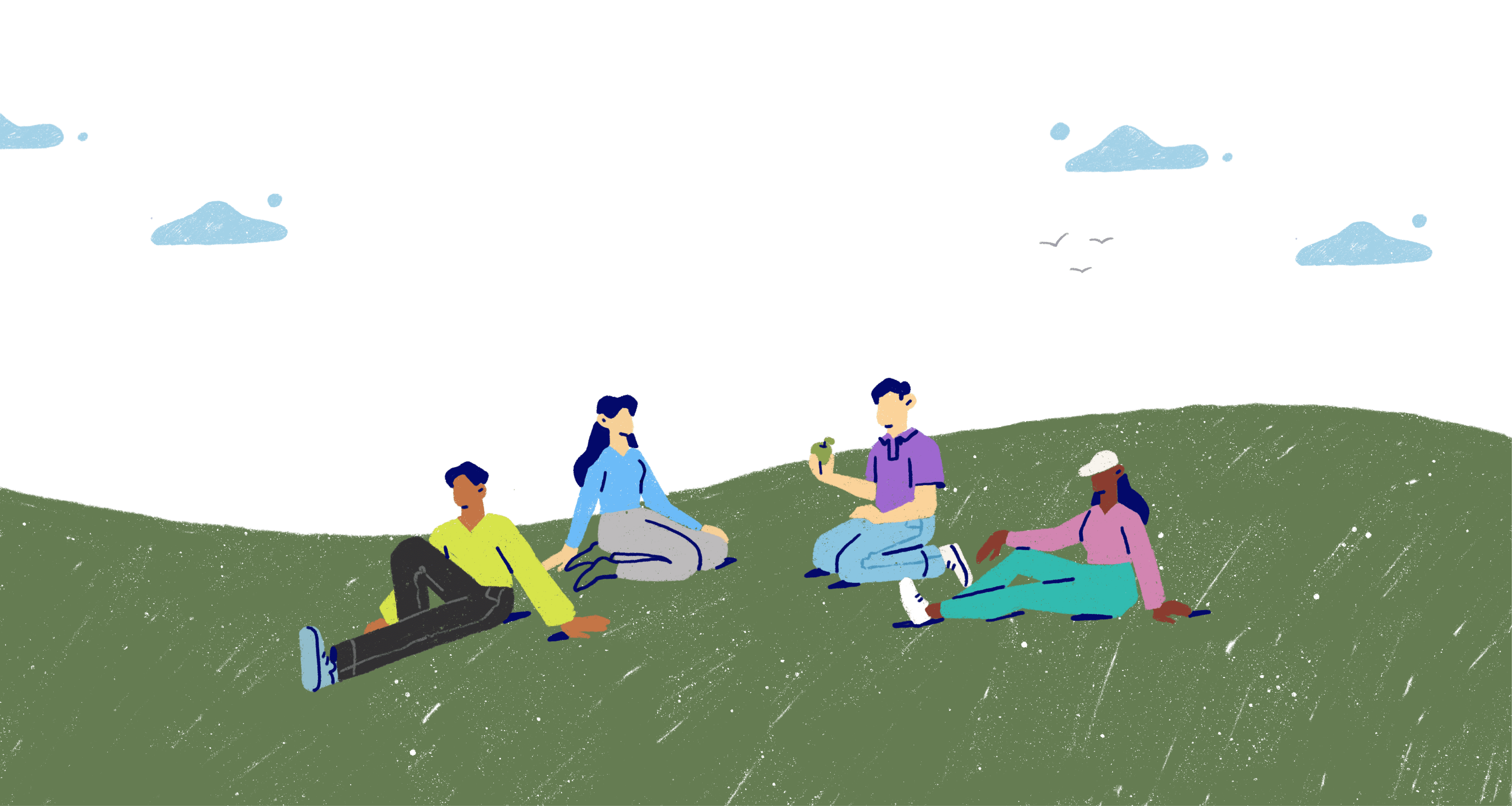 Four people sat down talking in a park